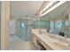 Bathroom with double vanity and large glass shower at 2337 Platinum Dr, Sun City Center, FL 33573