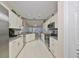Well-equipped kitchen with granite counters and stainless steel appliances at 2337 Platinum Dr, Sun City Center, FL 33573