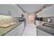 Modern kitchen with granite countertops and stainless steel appliances at 2337 Platinum Dr, Sun City Center, FL 33573