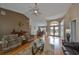 Open living area with hardwood floors, vaulted ceilings, and views of the entry and dining area at 2337 Platinum Dr, Sun City Center, FL 33573