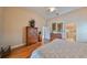 Large main bedroom with hardwood floors and ensuite bathroom at 2337 Platinum Dr, Sun City Center, FL 33573