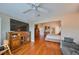 Main bedroom with hardwood floors and access to bathroom and large closet at 2337 Platinum Dr, Sun City Center, FL 33573