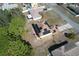 Aerial view of the home showcasing the backyard, solar panels, and proximity to surrounding residences at 2359 Gimlet Ave, Spring Hill, FL 34608