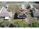 Aerial view of the property highlighting the solar panel roof, backyard patio, and surrounding neighborhood at 2359 Gimlet Ave, Spring Hill, FL 34608