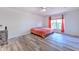 Bright bedroom with hardwood floors, ceiling fan, and natural light at 2359 Gimlet Ave, Spring Hill, FL 34608