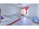 Bright bedroom boasts hardwood floors and natural light at 2359 Gimlet Ave, Spring Hill, FL 34608