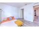 Bedroom exhibiting modern flooring, a cozy bed, and an open closet at 2359 Gimlet Ave, Spring Hill, FL 34608