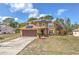 Two story home features an attached garage and solar panels at 2359 Gimlet Ave, Spring Hill, FL 34608