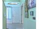 Hallway features fresh light mint paint and modern gray plank floors at 2359 Gimlet Ave, Spring Hill, FL 34608