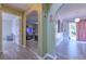 Hallway featuring arched doorways leading to other rooms, including a view of the living room at 2359 Gimlet Ave, Spring Hill, FL 34608