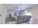 Bright living room with a ceiling fan, a plush rug, and three reclining chairs at 2359 Gimlet Ave, Spring Hill, FL 34608