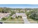 Stunning aerial view of a house near a lake at 3360 Hickorywood Way, Tarpon Springs, FL 34688