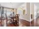 Dining room with hardwood floors, chandelier, and seating for six at 3360 Hickorywood Way, Tarpon Springs, FL 34688
