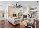 Bright living room with hardwood floors, fireplace, and view to kitchen and outdoors at 3360 Hickorywood Way, Tarpon Springs, FL 34688
