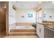 Spacious bathroom with a large tub, granite countertop, and tiled shower at 3360 Hickorywood Way, Tarpon Springs, FL 34688