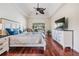 The primary bedroom features an ample-sized room with a view to the screened in lanai at 3360 Hickorywood Way, Tarpon Springs, FL 34688