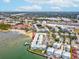 Aerial view of waterfront condo building with a parking lot nearby at 464 N Paula Dr # 322, Dunedin, FL 34698