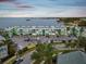 Aerial view showcasing the waterfront location and building's proximity to the water at 464 N Paula Dr # 322, Dunedin, FL 34698