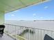 Relaxing balcony with water views and private seating at 464 N Paula Dr # 322, Dunedin, FL 34698