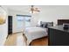 Main bedroom features a king bed and water views at 464 N Paula Dr # 322, Dunedin, FL 34698