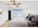 Main bedroom with water views and ceiling fan at 464 N Paula Dr # 322, Dunedin, FL 34698