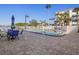 Relaxing community pool with patio seating at 464 N Paula Dr # 322, Dunedin, FL 34698