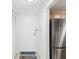 Inviting entryway with a white door and a welcome mat at 464 N Paula Dr # 322, Dunedin, FL 34698