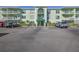 Building exterior with parking lot at 464 N Paula Dr # 322, Dunedin, FL 34698