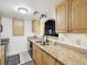 Kitchen with granite countertops and stainless steel appliances at 464 N Paula Dr # 322, Dunedin, FL 34698