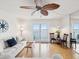 Bright living room with water views, hardwood floors, and comfortable seating at 464 N Paula Dr # 322, Dunedin, FL 34698