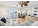 Living room features water views, hardwood floors, and ample natural light at 464 N Paula Dr # 322, Dunedin, FL 34698