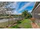 Landscaped backyard with water view and screened patio at 4919 Pamplona Ct., Wimauma, FL 33598