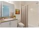 Clean bathroom with tub, shower, and updated vanity at 4919 Pamplona Ct., Wimauma, FL 33598