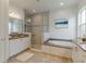 Spa-like bathroom with soaking tub and walk-in shower at 4919 Pamplona Ct., Wimauma, FL 33598