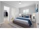 Comfortable bedroom with a king-size bed and walk-in closet at 4919 Pamplona Ct., Wimauma, FL 33598