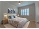 Cozy bedroom with a queen-size bed and window seating at 4919 Pamplona Ct., Wimauma, FL 33598