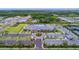 Aerial view of community clubhouse, pool, and tennis courts at 4919 Pamplona Ct., Wimauma, FL 33598
