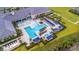 Resort-style pool with lap lanes and multiple lounging areas at 4919 Pamplona Ct., Wimauma, FL 33598