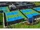Several pickleball and tennis courts with seating area at 4919 Pamplona Ct., Wimauma, FL 33598