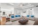 Open-concept living room with a view into the kitchen area at 4919 Pamplona Ct., Wimauma, FL 33598