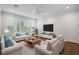 Comfortable living room with ample seating and natural light at 4919 Pamplona Ct., Wimauma, FL 33598