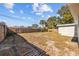 Large backyard with wooden fence and grassy area at 4923 Azalea Dr, New Port Richey, FL 34652