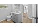 Updated bathroom with gray vanity and modern fixtures at 4923 Azalea Dr, New Port Richey, FL 34652