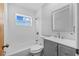 Clean bathroom with a bathtub, gray vanity, and a mirror at 4923 Azalea Dr, New Port Richey, FL 34652