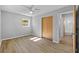Bright bedroom with wood closet doors and new flooring at 4923 Azalea Dr, New Port Richey, FL 34652