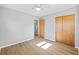 Spacious bedroom featuring wood-look floors and ample closet space at 4923 Azalea Dr, New Port Richey, FL 34652