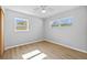 Bright bedroom with wood-look floors and neutral walls at 4923 Azalea Dr, New Port Richey, FL 34652