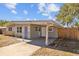 Ranch home with a covered carport and updated facade at 4923 Azalea Dr, New Port Richey, FL 34652