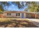 Updated ranch home with a fresh exterior and landscaping at 4923 Azalea Dr, New Port Richey, FL 34652