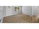 Bright living room with new flooring and fresh paint at 4923 Azalea Dr, New Port Richey, FL 34652